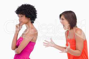 Side view of an arguement between two teenage girls