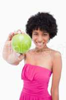 Beautiful green apple held by a young woman