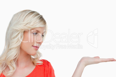Beautiful woman placing her hand palm up
