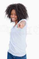 Young woman pointing her finger while laughing