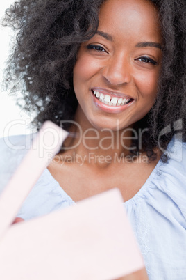 Young woman laughing after opening a gift