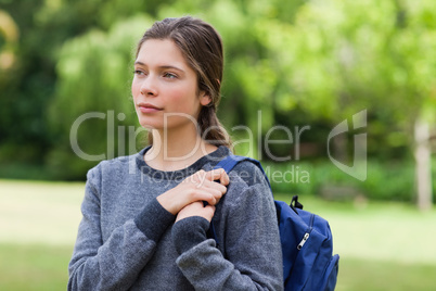 Young calm girl looking towards the side while standing in the c