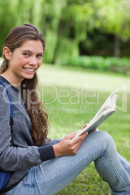 Young smiling girl looking at the camera while smiling and readi