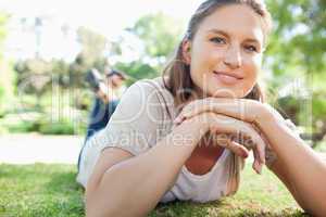 Smiling woman laying on the lawn