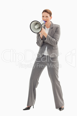 Businesswoman talking on a megaphone