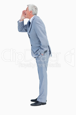 Profile of a businessman shouting