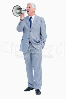 Businessman shouting with megaphone