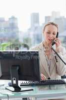 Woman on the phone in her office
