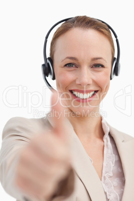 Portrait of a businesswoman with a headset approving