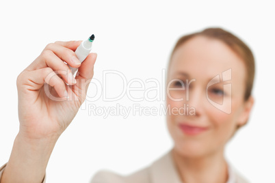 Businesswoman writing on a board