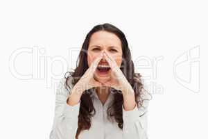 Portrait of a brunette yelling with hands