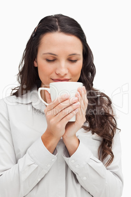 Brunette smelling a tea