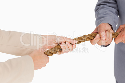 Business people pulling the rope