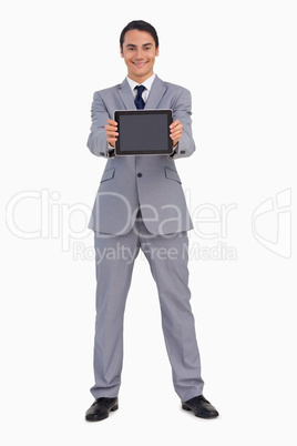 Man in a suit showing a tactile tablet screen