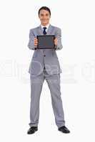 Man in a suit showing a tactile tablet screen