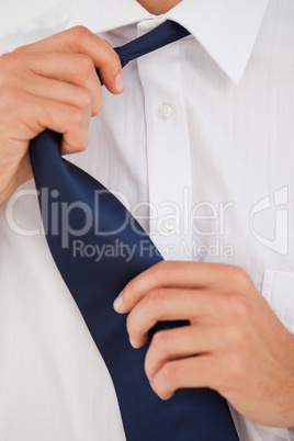 Man undoing his tie