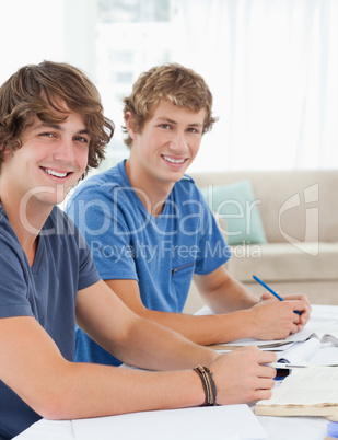 Close up of two smiling students looking into the camera