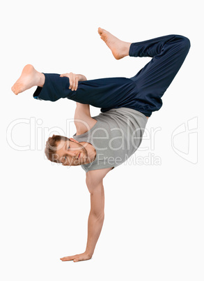 Break dancer doing an one handed handstand