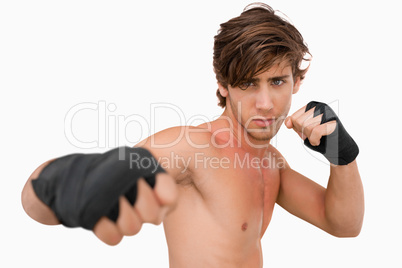 Martial arts fighter attacking with his fist