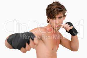 Martial arts fighter attacking with his fist