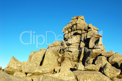 Huge rocks against blue sky