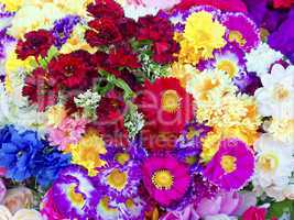 background of colorful artificial flowers