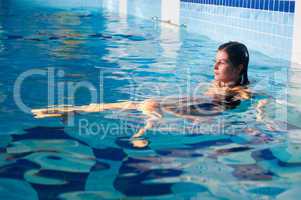 Attractive girl in swimming pool