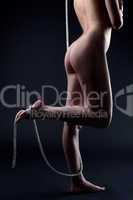 naked woman body with playful binded rope on it