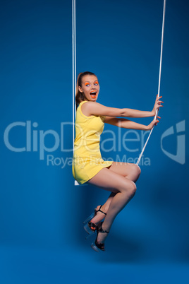 Sexy woman smile on swing with uv make-up