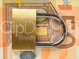 close up of a padlock on Euro banknote