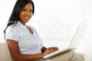 Pretty young woman working on laptop