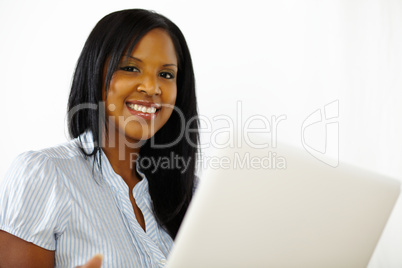 Cute young woman using a laptop