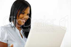 Cute young woman working on laptop