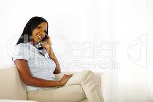 Elegant black young woman on mobile