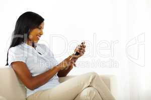 Cute young woman using a mobile phone