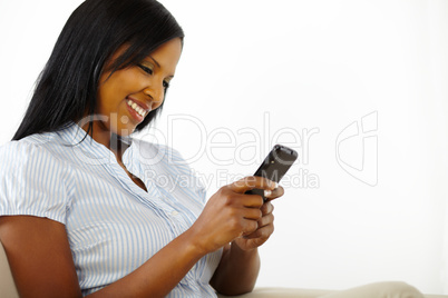 Charming young woman using a mobile phone