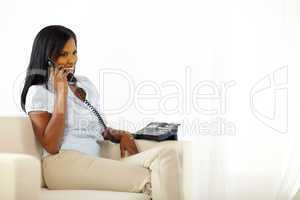 Woman talking on phone at home