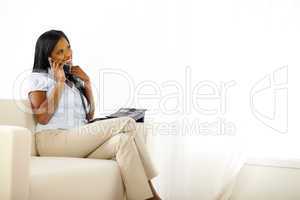 Relaxed pretty young lady speaking on phone