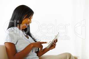 Happy young woman using a tablet PC