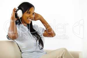 Young lady listening to music and having fun