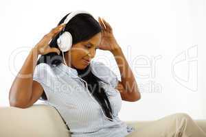 Young woman listening to music and having fun