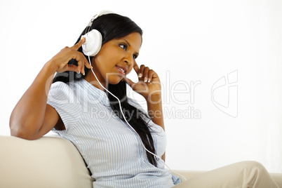 Young woman listening to music and resting