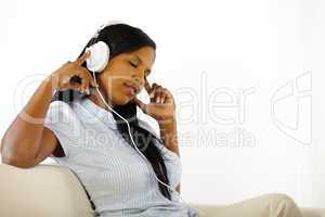 Calm young woman listening to music