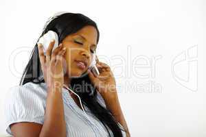 Calm young female listening to music