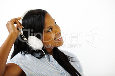 Smiling young female listening to music