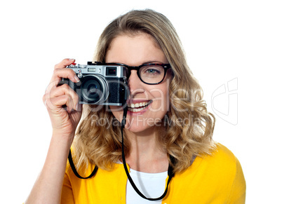 Beautiful young girl with camera