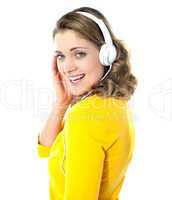 Attractive teenager tuned into music