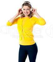 Gorgeous teenager enjoying music