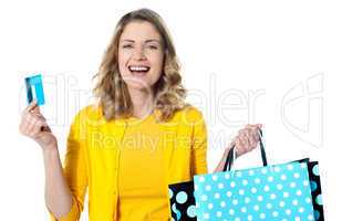 Happy shopaholic female laughing