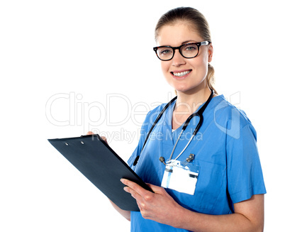 Friendly female doctor with a clipboard